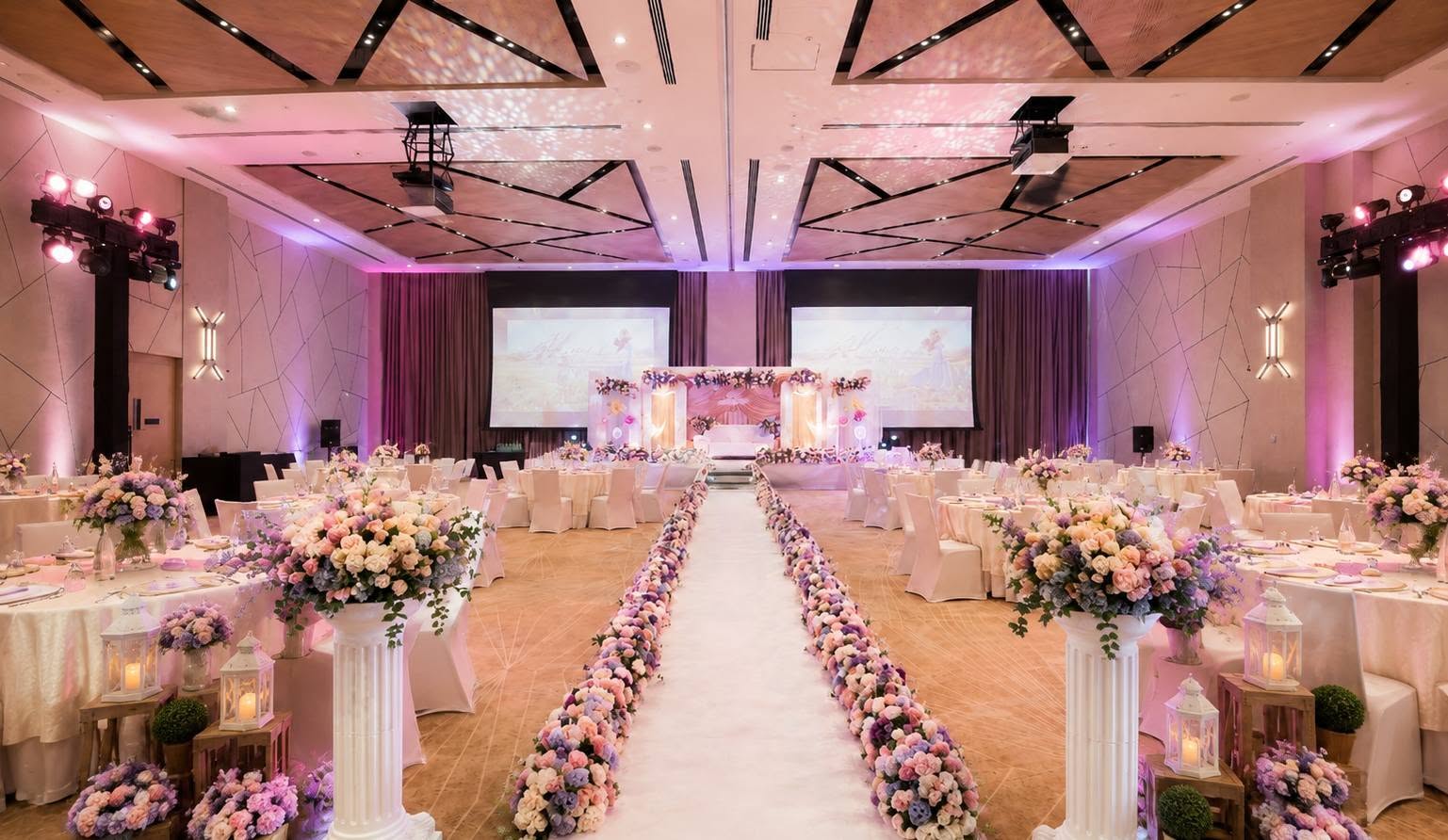 Floral-lined aisle and ballroom reception setup for a full-service wedding event in Abu Dhabi